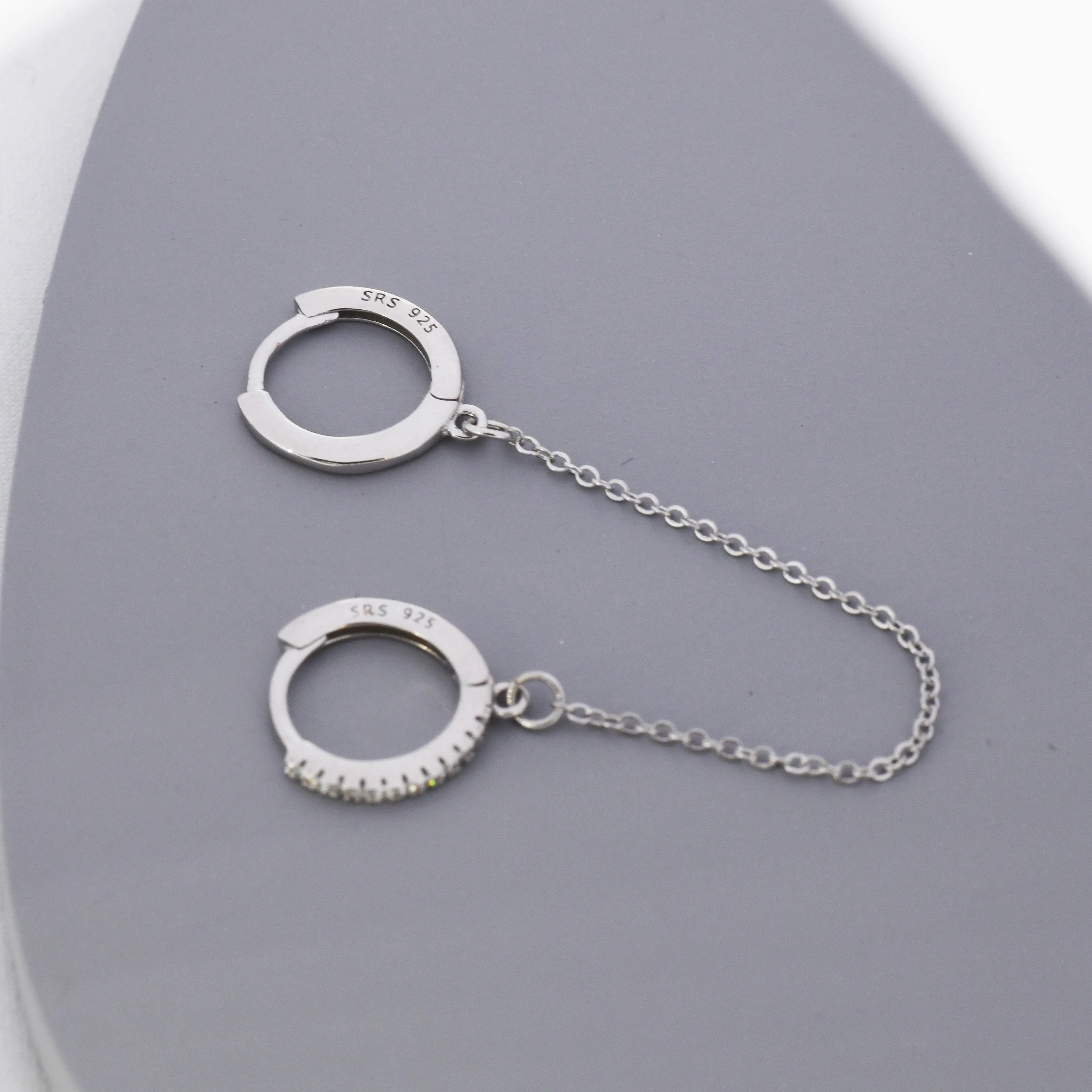 Asymmetric CZ Huggie Hoop Earrings with a Linking Chain, Chained Hoop Earrings, Linked Hoops, Linked Crystal Hoops - Image 2